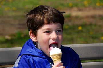 Image showing Boy licking ice cream