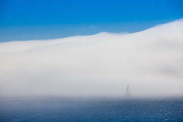 Image showing Lonely sailboat in the morning mist