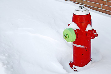 Image showing Red fire hydrant in the snow