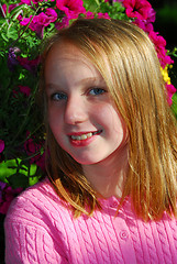 Image showing Young girl with flowers, portrait