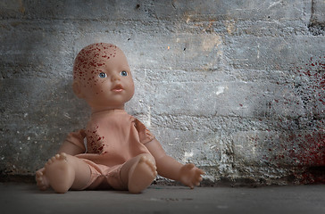 Image showing Concept of child abuse - Bloody doll