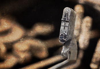 Image showing A hammer - old manual typewriter - warm filter