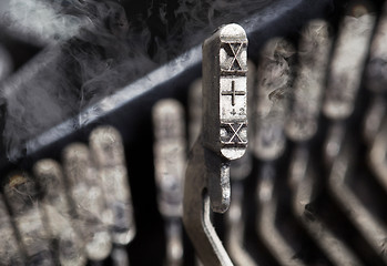 Image showing X hammer - old manual typewriter - mystery smoke