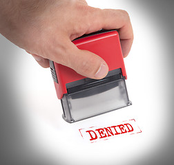 Image showing Plastic stamp in hand, isolated