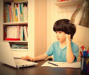 Image showing boy doing homework, portrait