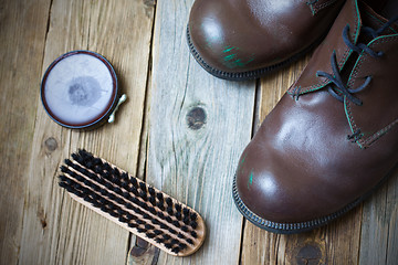 Image showing brown boots, shoe polish and shoe brush