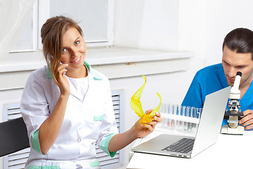 Image showing Doctor talking on a cell phone in lab