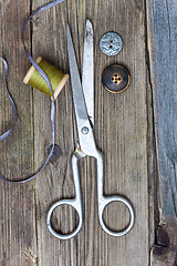 Image showing vintage dressmaker scissors, bobbin of thread and buttons