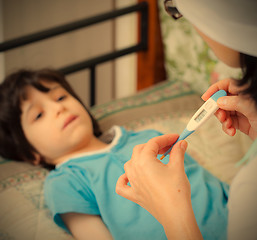 Image showing digital thermometer in the hands of a doctor