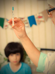 Image showing Doctor pediatrician with a syringe