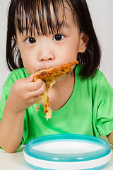 Image showing Little Asain Chinese Eating Pizza