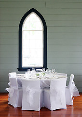 Image showing Tables decorated at a wedding reception.