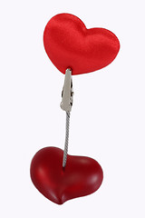 Image showing Clamp holding a velvet heart