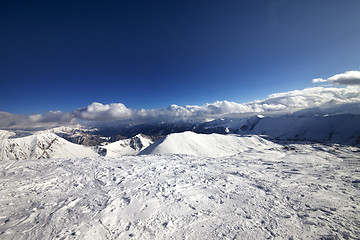 Image showing Wide-angle view on off-piste slope and snowy mountains