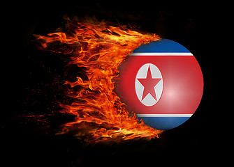 Image showing Flag with a trail of fire - North Korea