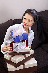 Image showing woman holds holiday boxes