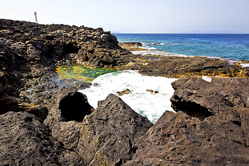 Image showing hervideros brown rock in white coast lighthouse