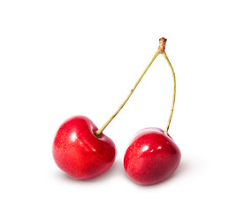 Image showing Two red juicy sweet cherries deployed