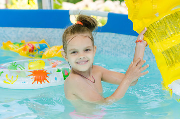 Image showing Six year old girl bathing in pool