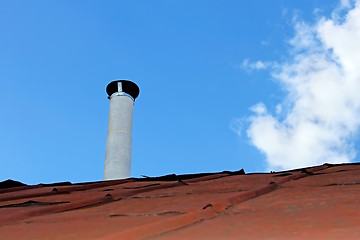 Image showing Chimney pipe over the old tinny roof