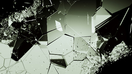 Image showing Shattered or cracked glass pieces on black