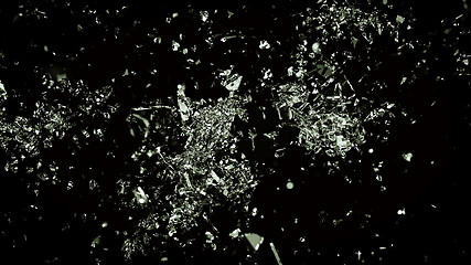 Image showing Broken and cracked glass on black