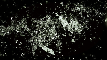 Image showing Shattered and cracked glass on black background