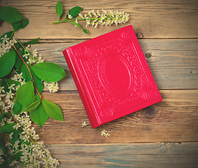 Image showing Blossoming bird-cherry and vintage album