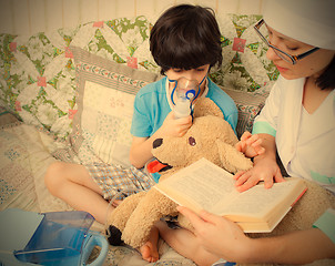 Image showing doctor pediatrician spends boy inhalation session