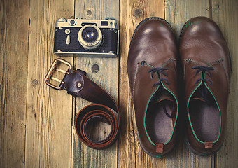 Image showing sturdy boots, leather belt, and rangefinder camera