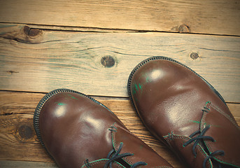 Image showing Two brown boots