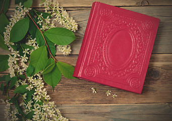 Image showing Blossoming bird-cherry and vintage book