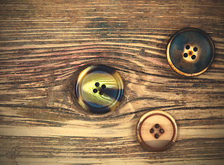 Image showing three old buttons