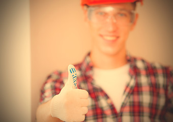 Image showing worker showing thumb up