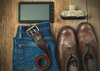 Image showing digitizer, rangefinder camera, brown boots, leather belt and blu