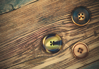 Image showing three aged buttons