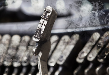 Image showing L hammer - old manual typewriter - mystery smoke