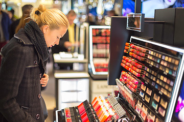 Image showing Beautiful woman shopping in beauty store.