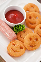 Image showing sausages with smiling potatoes