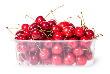 Image showing Red juicy sweet cherries in a plastic tray