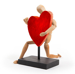 Image showing Wooden mannequin with a big heart