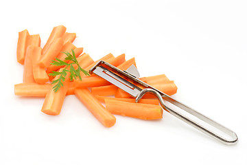 Image showing Carrots cut by slices and a knife
