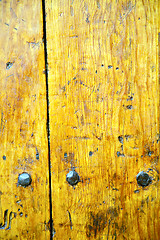 Image showing nail dirty stripped paint in the   yellow