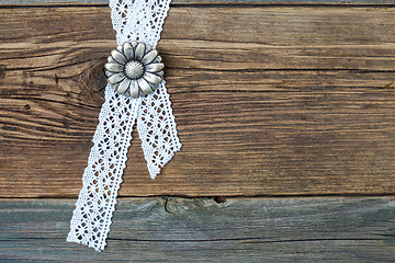 Image showing vintage metal buttons flowers and lace tape