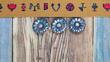 Image showing vintage band with embroidered ornaments and old buttons