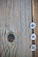 Image showing three metal vintage buttons