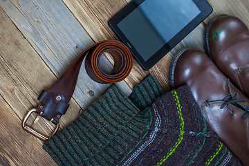 Image showing vintage belt, leather boots, sweater and digitizer 