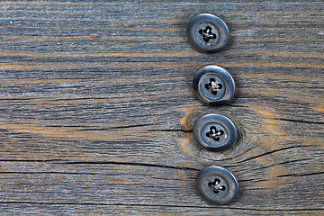 Image showing four metal buttons