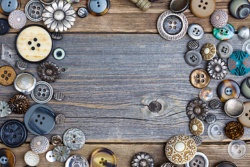 Image showing placer of vintage buttons with copy space on textured old boards