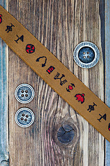 Image showing vintage band with embroidered ornaments and old buttons